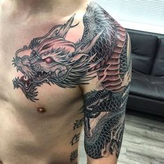 a man with a dragon tattoo on his chest