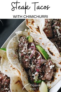 steak tacos with cilantro, onions and jalapenos on a white plate