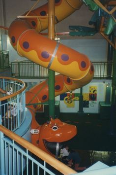 an indoor play area with slides and toys