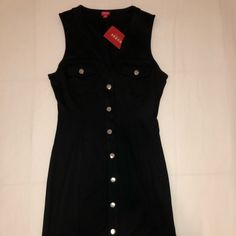 Brand New With Tags ! Say Hello To Your Next Little Black Dress Silver Clasp Buttons Top To Bottom. Can Be Easily Dressed Up Or Down! Black Sleeveless Mini Dress With Buttons, Trendy Sleeveless Mini Dress With Button Closure, Fitted Sleeveless V-neck Dress With Buttons, Fitted Casual Sleeveless Dress With Buttons, Fitted Sleeveless Dress With Buttons For Casual Wear, Black Sleeveless Dress With Buttons For Spring, Casual Fitted Sleeveless Dress With Button Closure, Chic Black Sleeveless Dress With Buttons, Black Sleeveless Dress With Button Closure