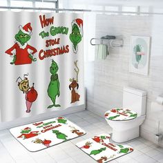 a bathroom decorated for christmas with the grinch shower curtain and toilet cover, along with matching rugs