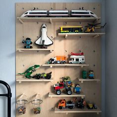 the shelves are filled with toy vehicles and toys