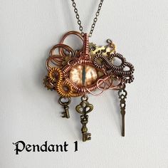 a necklace with keys and charms attached to it