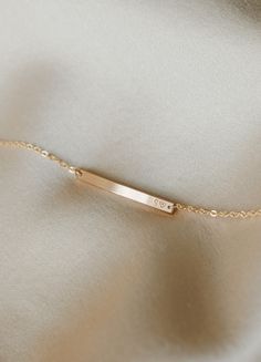 Versatile, practical and light-catching—this bracelet raises the bar. Personalize with names, dates, initials, coordinates or a short mantra (and wrap your wrist with what means most). Looking for something subtler? Try our teeny Basquiat Bar Bracelet (best for extra short, tiny inscriptions)! Looking for something bolder? Our Serra Bar Bracelet is our largest ID-type bracelet.