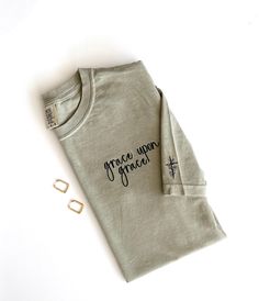 Basic Cotton Tops With Custom Embroidery And Relaxed Fit, Basic Relaxed Fit Top With Custom Embroidery, Long Sleeve Cotton Shirt With Embroidered Text, Cotton Long Sleeve Shirt With Embroidered Text, Basic Embroidered Cotton Tops, Cotton Shirt With Embroidered Graphics And Relaxed Fit, Cotton Shirt With Embroidered Graphics Relaxed Fit, Cotton Shirt With Embroidered Graphics In Relaxed Fit, Long Sleeve T-shirt With Custom Embroidery In Relaxed Fit