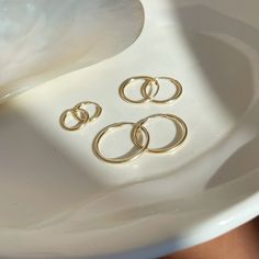 These sweet and delicate little hoops are the newest addition to our earring collection. Simple + effortless, our Goldie Hoops are a favorite for everyday style. MEASUREMENTS Available in 14k Gold Fill or Sterling Silver in 10mm, 14mm, or 16mm diameter14k Rose Gold Fill available in 16mm diameterChoose between a single earring or a pair. 14k Gold Small Hoop Stackable Earrings, 14k Gold Stackable Huggie Earrings As A Gift, Small 14k Gold Stackable Hoop Earrings, Delicate Tarnish-resistant Huggie Earrings For Everyday, Delicate Everyday Huggie Hoop Earrings, Delicate Yellow Gold Huggie Earrings For Everyday, Delicate Everyday Hoop Huggie Earrings, Dainty 14k Gold Round Huggie Earrings, 14k Gold Stackable Hoop Earrings As Gift