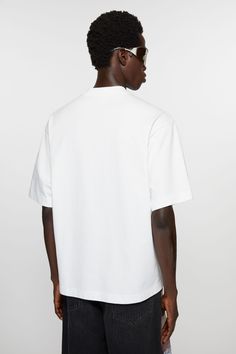 T-shirt is crafted from midweight jersey cotton and detailed with an Acne Studios logo on the centre front. Cut to a relaxed fit. Modern Crew Neck T-shirt With Branding, Modern Short Sleeve T-shirt With Logo, White Relaxed Fit T-shirt With Logo, Relaxed Fit Cotton Jersey T-shirt With Short Sleeves, Basic Relaxed Fit T-shirt With Logo Print, Classic Short Sleeve T-shirt With Logo, Modern Cotton T-shirt With Branding, Modern Short Sleeve T-shirt With Branding, Sporty Relaxed Fit T-shirt With Embroidered Logo