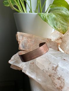 This beautiful copper bracelet has been hand made by my husband with love and intention with the purpose of helping you heal physically, mentally and spiritually.  This bracelet is 5 1/4 inches of copper with a 1 1/4 inch opening. The copper is pliable and can be adjusted to your desired size and fit. The fit will vary depending on your wrist size.    Copper is a conductor of energy and frequency. (Perfect to layer with crystal bracelets as it magnifies their energy) It is a wonderful tool to balance the chakras and helps to rid your energy field of any negativity.  Copper heightens Intuition, increases vitality, and boosts energy. It is also a bringer of good luck.  Copper has been known to increase blood flow and combat lethargy and restlessness. Spiritual Bronze Copper Cuff Bracelet, Copper Cuff Bracelet, Copper Cuff, Les Chakras, Energy Field, Copper Bracelet, Handmade Copper, Boost Energy, Blood Flow