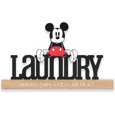 a mickey mouse sign with the word laundry on it