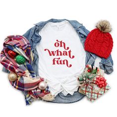 This retro Christmas tee is so light & comfy. It makes a great gift for friends and family with a fun sense of humor. It fits like a well-loved favorite. Unisex style and sizing. Soft, light weight cotton. These t-shirts have-ribbed knit collars to bolster shaping. The shoulders have taping for better fit over time. Dual side seams hold the garment's shape for longer. 100% Airlume combed and ringspun cotton (fiber content may vary for different colors) Light fabric Retail fit Tear away label Runs true to size These shirts are made to order. Unfortunately, we are unable to speed up production times. It may be possible to expedite shipping only for an additional fee. Please message us for more information. Since all of our shirts are made to order, we do not accept returns. However, your sat Retro Christmas Shirt, Funny Holiday Shirts, Babe Shirt, Christmas Party Shirts, Womens Christmas Shirts, Pregnancy Announcement Shirt, December 24th, Funny Christmas Shirts, Family Christmas Shirts