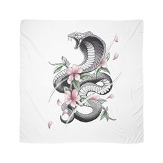 a white blanket with pink flowers and a black snake on the front, it's head