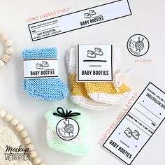 three baby booties with labels on them sitting next to a beaded necklace and bracelet