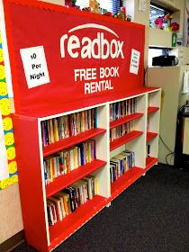 a red and white bookcase with free books on it in a room filled with children's toys