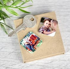 a couple's photo is placed on top of a cork board with a key