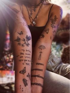 a woman with many tattoos on her legs