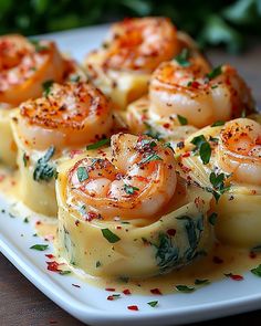 some food is on a white plate and garnished with parsley, salt and pepper