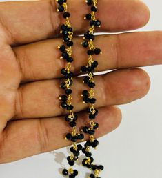 Best quality Beautiful 3mm Black faceted glass Beads Cluster Rosary chain. gold Plated brass wire Dangling Cluster Rosary Chain. Beaded beads Chain. Fashion Jewelry body chain. Chain for Bracelet, Necklace, anklet, earrings, body Jewelry finding. wholesale price chain. 3mm black faceted rondelle beads bulk roll chain. handmade beaded beads dangle cluster chain Gemstone - Black faceted glass beads Size- 3-3.5 mm Type -  beaded Gold Jewelry With Round Black Beads, Gold Beaded Necklaces With Gemstone Dangle, Gold Dangle Beaded Necklace With Gemstone Beads, Gold Dangle Beaded Necklace With Gemstones, Gold Beaded Necklaces With Faceted Round Beads, Gold Gemstone Beads For Party, Faceted Dangle Beads For Jewelry Making, Black Jewelry With Faceted Oval Beads, Black Jewelry With Oval Faceted Beads