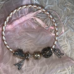 Authentic Pandora Champagne-Colored Braided Leather Bracelet With Four Sterling Silver Charms (Also From Pandora): - Eiffel Tower - Taxi - Open Your Heart - Initial “R” In Amazing Conditiononly Worn Twice. Perfect Gift For Valentine’s Day! Feel Free To Make An Offer. Ships Same/Next Day! Initial R, Pandora Jewelry Charms, Jewelry Pandora, Gift For Valentine, Pandora Bracelet Charms, Sterling Silver Charms, Braided Leather Bracelet, Pandora Silver, Pandora Charm