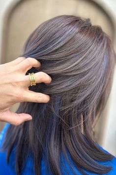 Woman with brown hair and subtle blue highlights. Blonde And Red Balayage, Brown Hair With Blue Highlights, Hair With Blue Highlights, Peek A Boo Color, Brown Hair With Blue, Blue Brown Hair