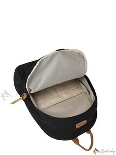 an open black and white backpack with zippers on the front, side pocket and bottom compartment