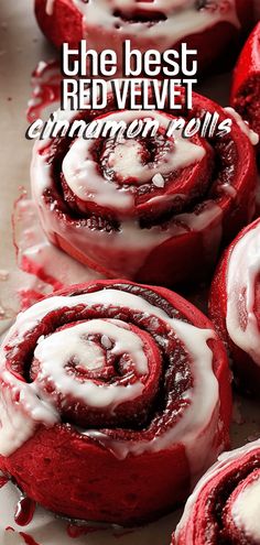 red velvet cinnamon rolls with white icing on top and the words, the best red velvet cinnamon rolls