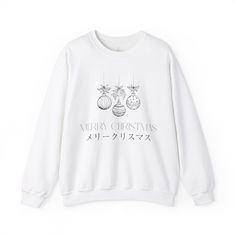 Stay cozy and festive this holiday season with this Christmas Tree Decoration Sweatshirt with Japanese characters wishing 'Merry Christmas'. Perfect for anyone looking to add some holiday spirit to their wardrobe, this unisex sweatshirt is made with a medium-heavy fabric blend of 50% cotton and 50% polyester, ensuring warmth and comfort during the colder months. The classic fit and crew neckline provide a clean-cut style, while the double-needle stitching adds durability. Say goodbye to itchines Christmas Sweatshirt Gift, Christmas Gift Sweatshirt With Relaxed Fit, White Christmas Holiday Sweatshirt, White Christmas Sweater As A Gift, White Christmas Sweater As Gift, White Christmas Sweater With Graphic Print, White Christmas Graphic Print Sweater, White Winter Sweatshirt For Gift, White Winter Sweatshirt Gift