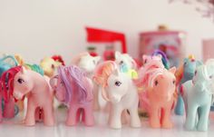 there are many toy horses lined up on the table