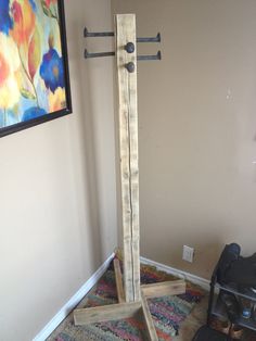 Coat Rack Out of Scrap: This is a coat rack i made out of an old piece of 4X4, (nicely cracked up), some 2X4 pieces, and railway spikes. The 4X4 is 6' tall with 4 16" 2X4s at the base all screwed together and sanded. To attached the spikes i just drilled a 5/8" pilot hole … Standing Coat Rack Diy, Coat Rack Freestanding, Diy Freestanding Coat Rack, Welding Projects Railroad Spikes, Diy Railroad Spikes Ideas, Railroad Spikes Ideas, Railroad Spike Ideas, Coat Rack Ideas, Railroad Spikes Crafts