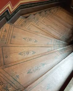 an old wooden staircase with intricate designs on it