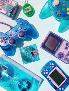 several different types of video game controllers and accessories on a white surface with blue ink