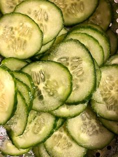 sliced cucumbers in a colander ready to be washed and put into the water