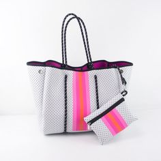 Neoprene tote. Water Resistant. Available in pink/orange strip and Turquoise strip. Material: Neoprene (The same material that wet-suits are made of.) Dimensions:Tote: 14.2" length left to right looking at face of bag15.4" height9.8" base front to back widthPouch: 7.75" x 5.5 " Tas Bahu, Neoprene Bag, Neoprene Tote, Oversized Tote Bag, Carryall Tote, Oversized Tote, Bungee Cord, Orange Crush, Mini Pouches