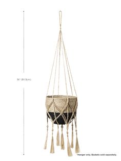 a hanging planter with tassels on it and measurements for the height chart