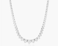 14K White Gold Riviera Three Prong Graduating Diamond Tennis Necklace (5.00 CTW - H-I / SI1-SI2). A dazzling array of round brilliant diamonds gracefully graduate towards the center. This luxurios and elegant tennis necklace features three prong settings and a box catch with hidden safety. Luxury White Necklace With Prong Setting, White Platinum Tennis Necklace With Diamond Accents, Luxury Heart Cut Necklace With Prong Setting, Luxury White Platinum Tennis Necklace, Dazzling White Platinum Necklace, White Platinum Tennis Necklace With Prong Setting, White Platinum Tennis Necklace With Single Cut Diamonds, White Gold Bridal Necklace With Vvs Clarity Round Cut, White Platinum Tennis Necklace With Brilliant Cut