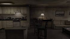 a dimly lit living room and kitchen area