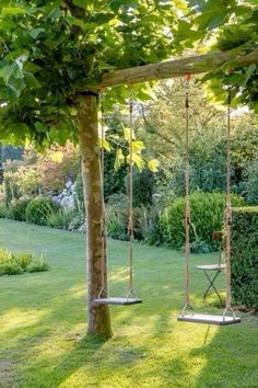 a swing set in the middle of a garden