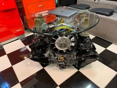 an engine is sitting on top of a checkered floor