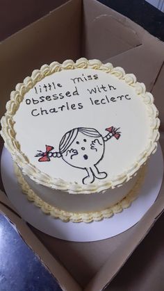 a birthday cake in a box with writing on it that says little miss obsesed with charles lecler