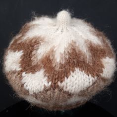 "This is a nice vintage hand knitted chunky wool hat! The hat has a minimalist argyle style, it is light and slightly fluffy. I would guess it will fit all, it has a light elastic at the hem, I have tried it on, it is very comfortable and light. Super warm! MAKE: Most likely made in France as it was found at a French vintage boutique. CONDITION: Excellent. MATERIAL: 100% chunky wool. MEASUREMENTS NOTE: Please refer to the exact measurements and sizing table I used, as this one does not have size labels! Circumference (stretched): 60cm/23.5\" All my items are preloved vintage and retro items, unless stated differently. Colours may look different on each viewing screen. All items are sold \"as is\" so if you have any additional questions about this item, please don't hesitate to ask before p Cozy Handmade Brown Hats, One Size Brown Beret For Winter, Brown One Size Beret For Winter, Vintage Brown Beret For Winter, Handmade Brown Beanie, Brown Vintage Winter Beret, Brown Hand-knitted Beanie For Winter, Brown Hand Knitted One-size Beanie, Brown Hand-knitted Beanie