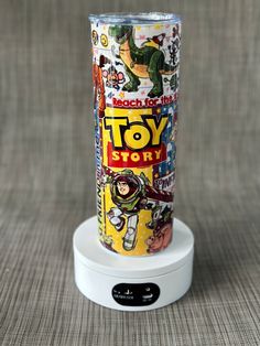 a toy story can sitting on top of a charger