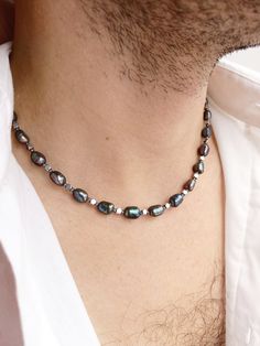 Mens black pearl necklace, Real pearl beaded y2k choker, Surfer hematite necklace, Boyfriend gift ideas, Black baroque pearl necklace men Pearls have long ceased to be in the arsenal of only women. Men easily complement their look with a classic string of pearls or a single pearl on a chain. It is not only fashionable and stylish, but also beautiful. Give this necklace to your boyfriend, believe me, he will not remain indifferent. I only use natural freshwater pearls so I don't have perfect identical round beads like plastic ones. Each pearl, like a person, is unique, with its own life story, each bead has its own stripes - these are mother-of-pearl layers. Black pearls are doubly unique and interesting. And in combination with faceted hematite, such a necklace will make you look modern, b Men Pearls, Bff Fashion, Y2k Choker, Pearl Necklace Real, Pearl Necklace Men, Necklace Boyfriend, Boyfriend Gift Ideas, Real Pearl Necklace, Black Pearl Necklace