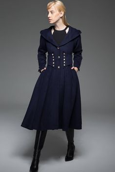 Crafted in warm wool, this navy military style wool long coat is designed to give an up-to-date and modern look with distinctive styling. This is outerwear that will make you stand out in the crowd. Wear this winter staple for perfect off-duty outfitting. The Military Coat features a gorgeous nipped in waist with button details. The hooded coat also has more button details on the cuffs and this detailing gives long hooded coat its military styling. The blue military coat has a fit and flare fit Long Hooded Coat, Wool Long Coat, Military Style Coats, Navy Military, Military Coat, Long Wool Coat, Style Coat, Coat Design, Military Style