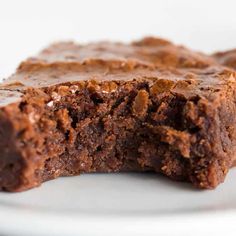 two pieces of chocolate brownie on a white plate