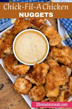 chicken nuggets on a plate with dipping sauce in the middle and text overlay that reads, chicken - fil - a - a - a - chicken nuggen nuggies