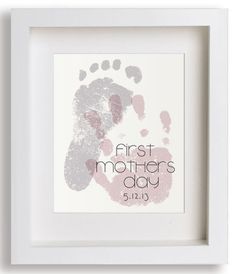 a baby's hand and foot print with the words first mothers day printed on it