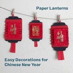 three red paper lanterns with chinese characters hanging from string on white wall and below text that reads, paper lanterns easy decorations for chinese new year