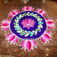 a blue and pink flower design on the ground