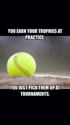 a yellow softball sitting on top of a baseball field