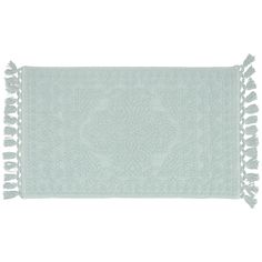 a light blue rug with tassels on the bottom and fringed edges, against a white background