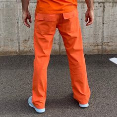 Orange is the new orange. For that convict lifestyle everyone's after. But seriously, these orange pants are power! Great fit. Great feel. Great find! The man who is actually not a convict modeling these pants is wearing a size 33 x 32 and he is 6 feet tall and weighs about 185 pounds when he's committed to P90X. Look at those arms. 100% cotton. Complete the look: orange v-neck t-shirt orange belt orange socks Orange Relaxed Fit Pants With Pockets, Relaxed Fit Orange Pants With Pockets, Casual Orange Cargo Pants For Streetwear, Orange Cotton Cargo Bottoms, Cotton Cargo Bottoms In Orange, Orange Relaxed Fit Cotton Pants, Orange Cotton Pants For Streetwear, Orange Relaxed Fit Straight Leg Bottoms, Casual Orange Straight Leg Pants